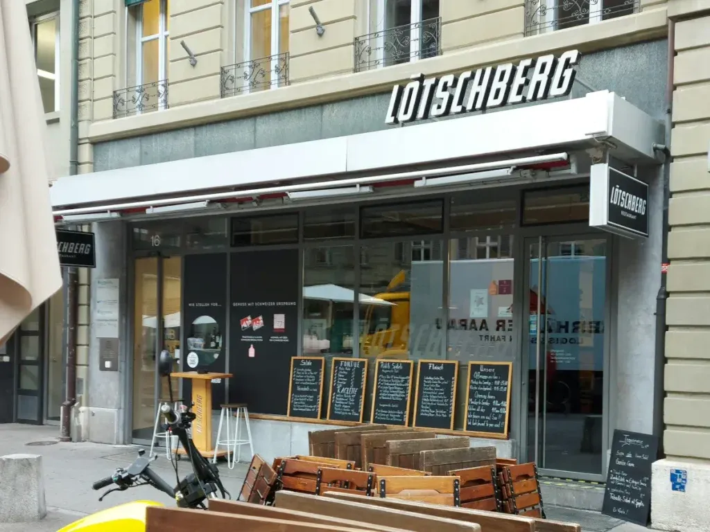 Exterior view of Lötschberg Bern in the Old Town with pedestrian zone and tables