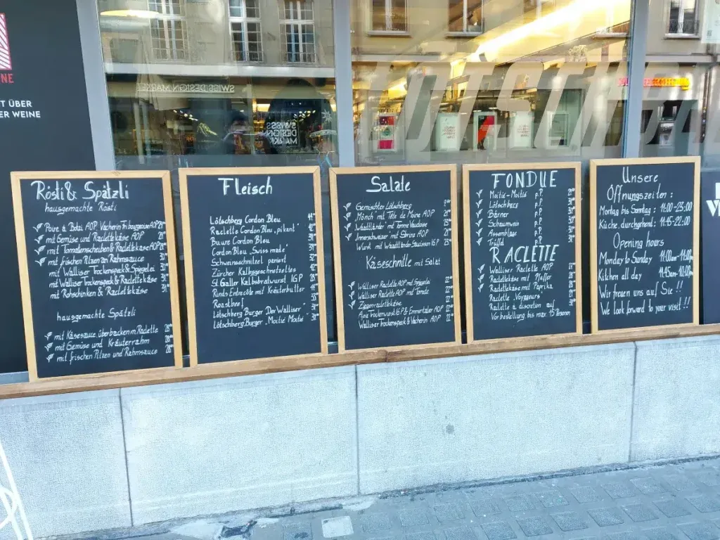 The menu of Lötschberg Bern on a table, overlooking the Old Town alley