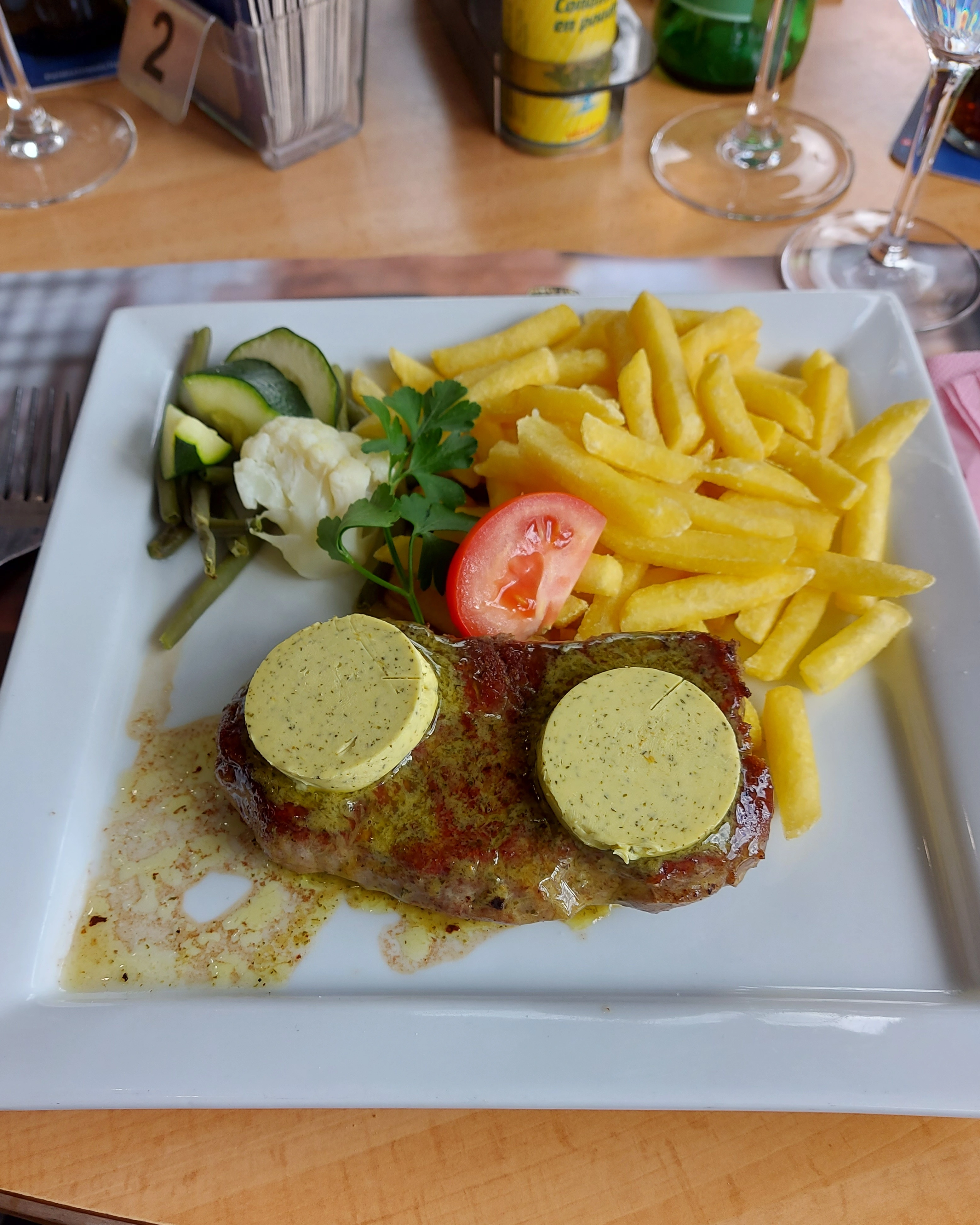 Entrecôte with herb butter and chips at Trucker Restaurant Bar Bern