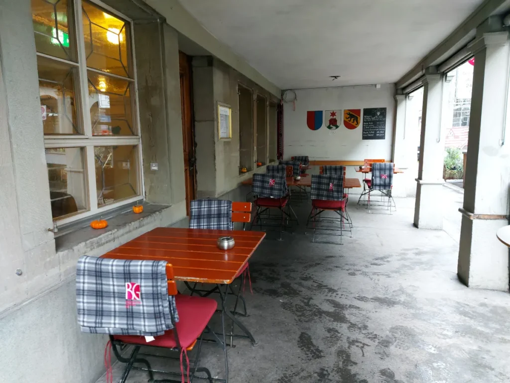 Outdoor seating in the historic sandstone "Laube" (arcades) in front of Della Casa Bern.