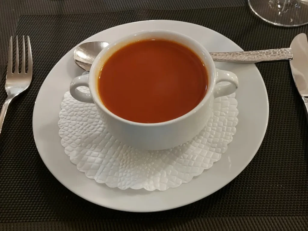 Traditional venison plate with venison cutlets, red cabbage, and spätzli at Restaurant Della Casa Bern.